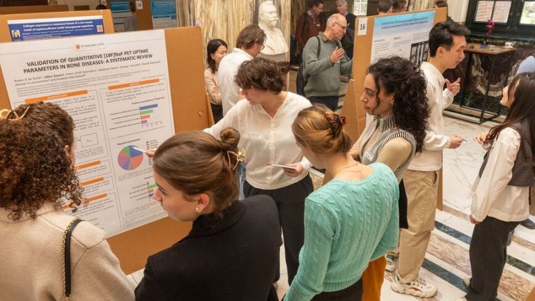 Scientists discussing the results in a poster session